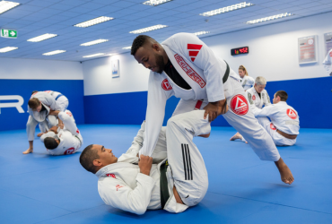 Expert Brazilian Jiu-Jitsu students training advanced techniques at Gracie Barra